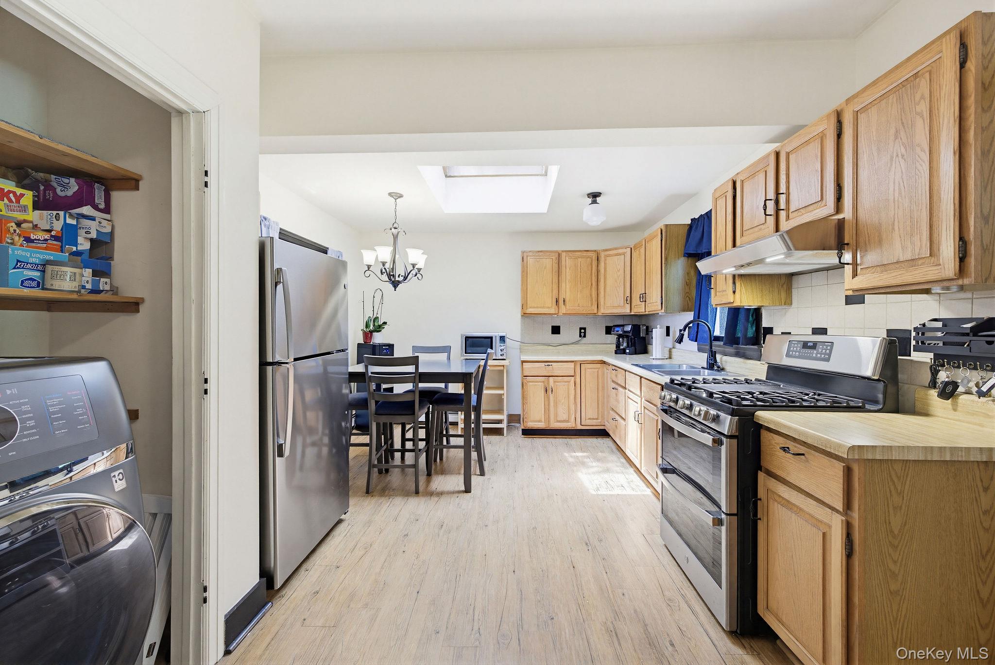 12 Bradhurst Road Carmel, NY 10512 - Photo 12 of 28 a kitchen with cabinets and wooden floor