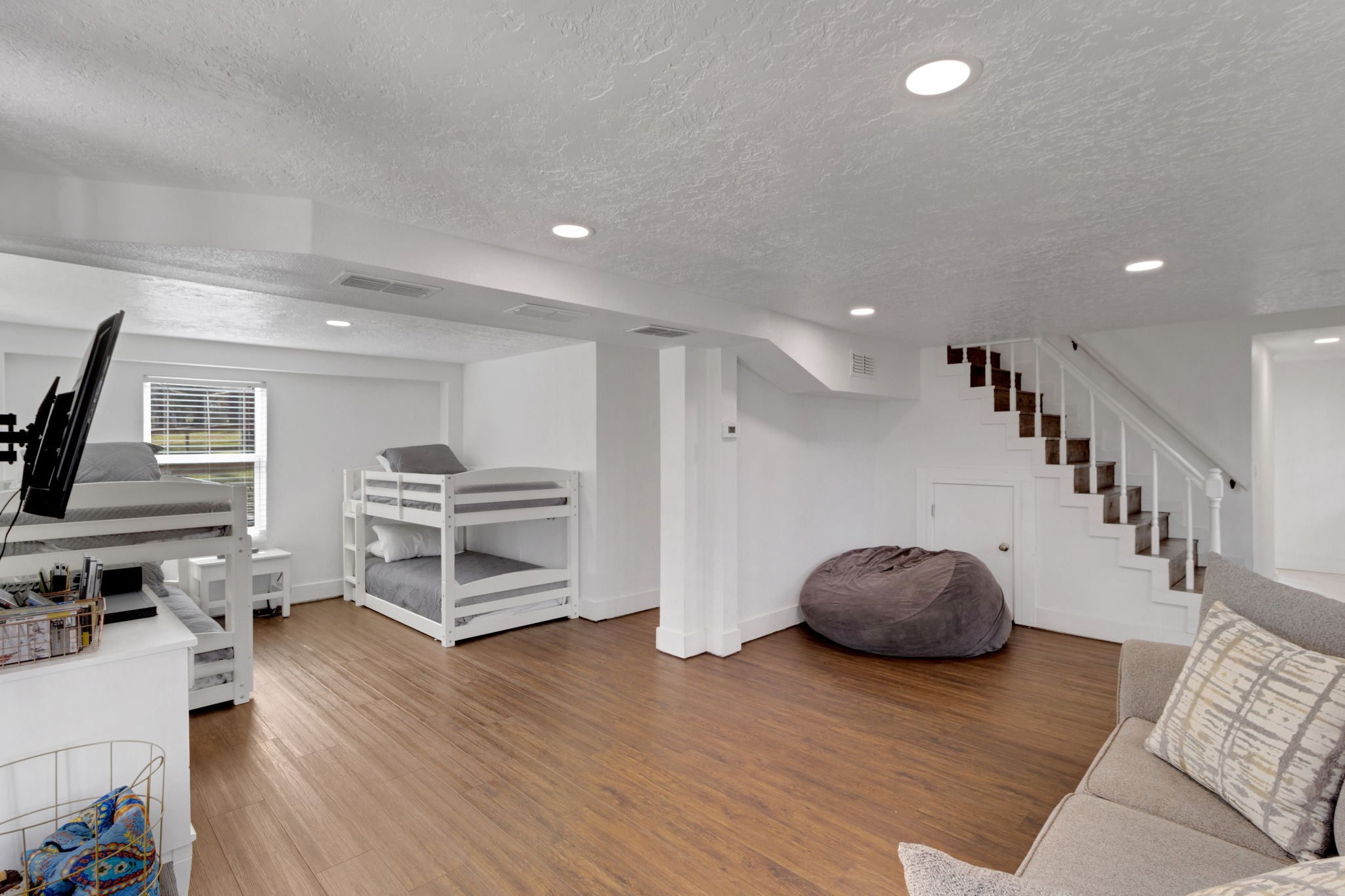 21 Red Bird Lane Coldspring, TX 77331 - Photo 18 of 37 Head downstairs from the main living area to the bunk room / extra room