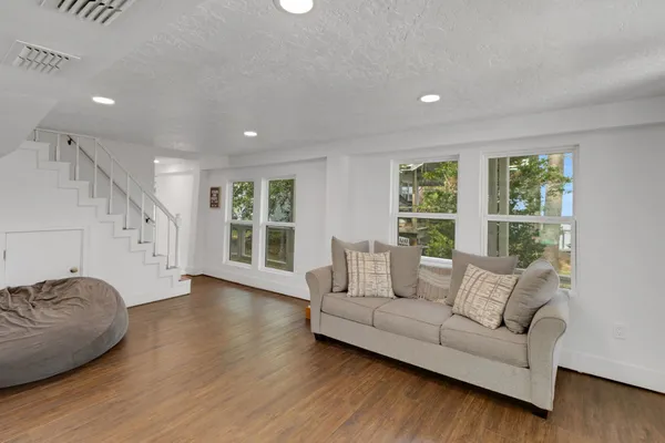 a living room with furniture and a large window