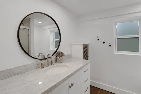 a bathroom with a sink and a mirror