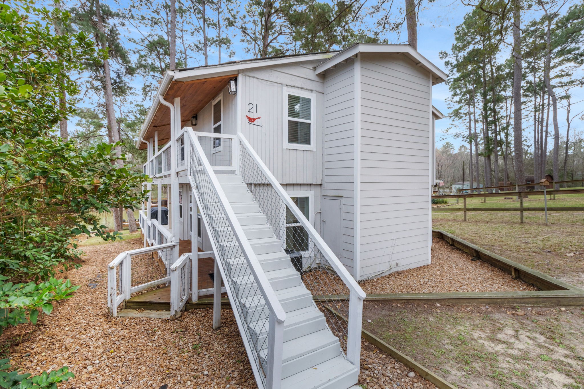 21 Red Bird Lane Coldspring, TX 77331 - Photo 3 of 37 The two story home has been completely updated - ready for you to start enjoying life by the lake
