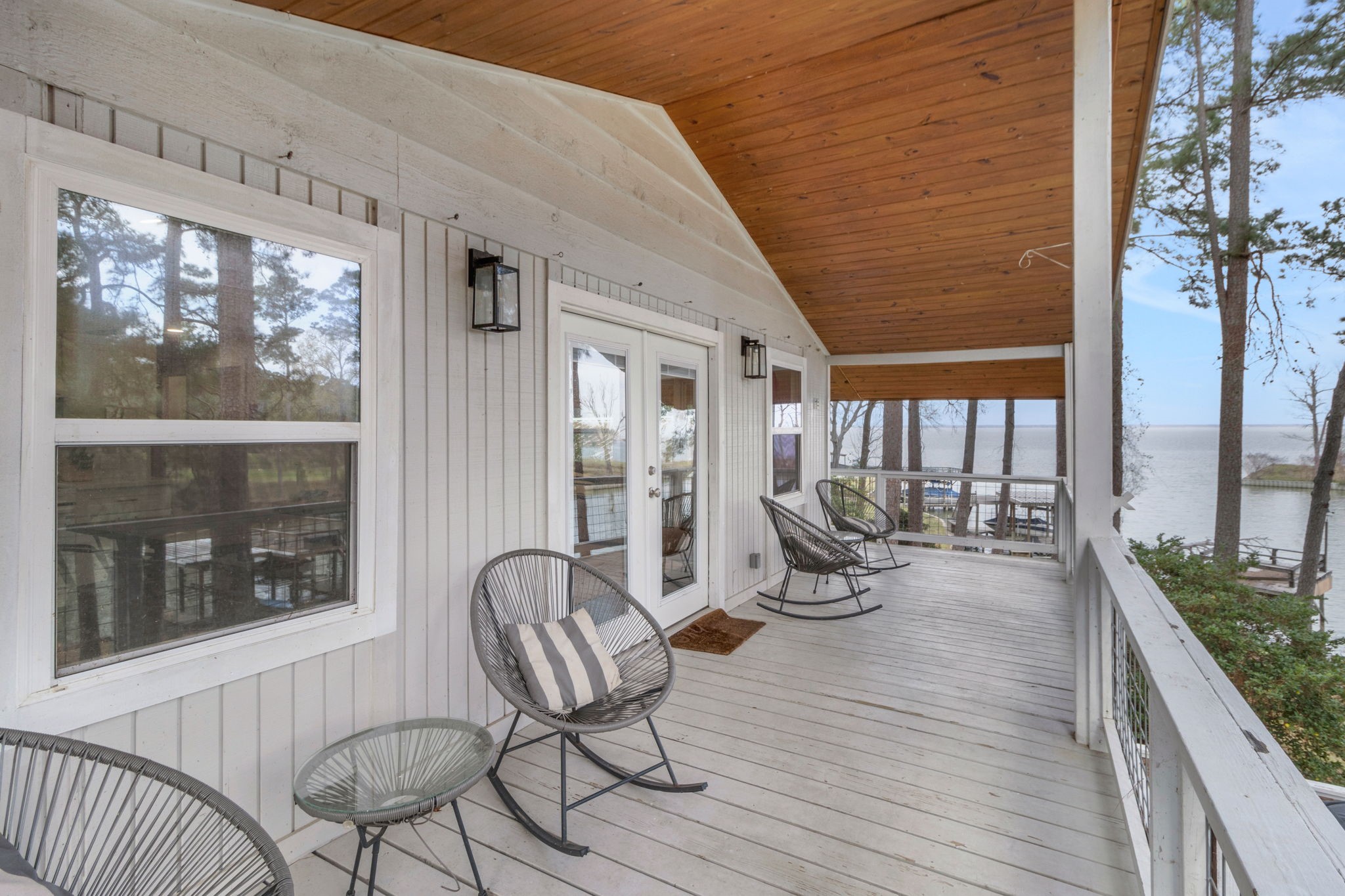21 Red Bird Lane Coldspring, TX 77331 - Photo 6 of 37 The upper deck spans the home and is a great spot for your morning coffee or evening beverage