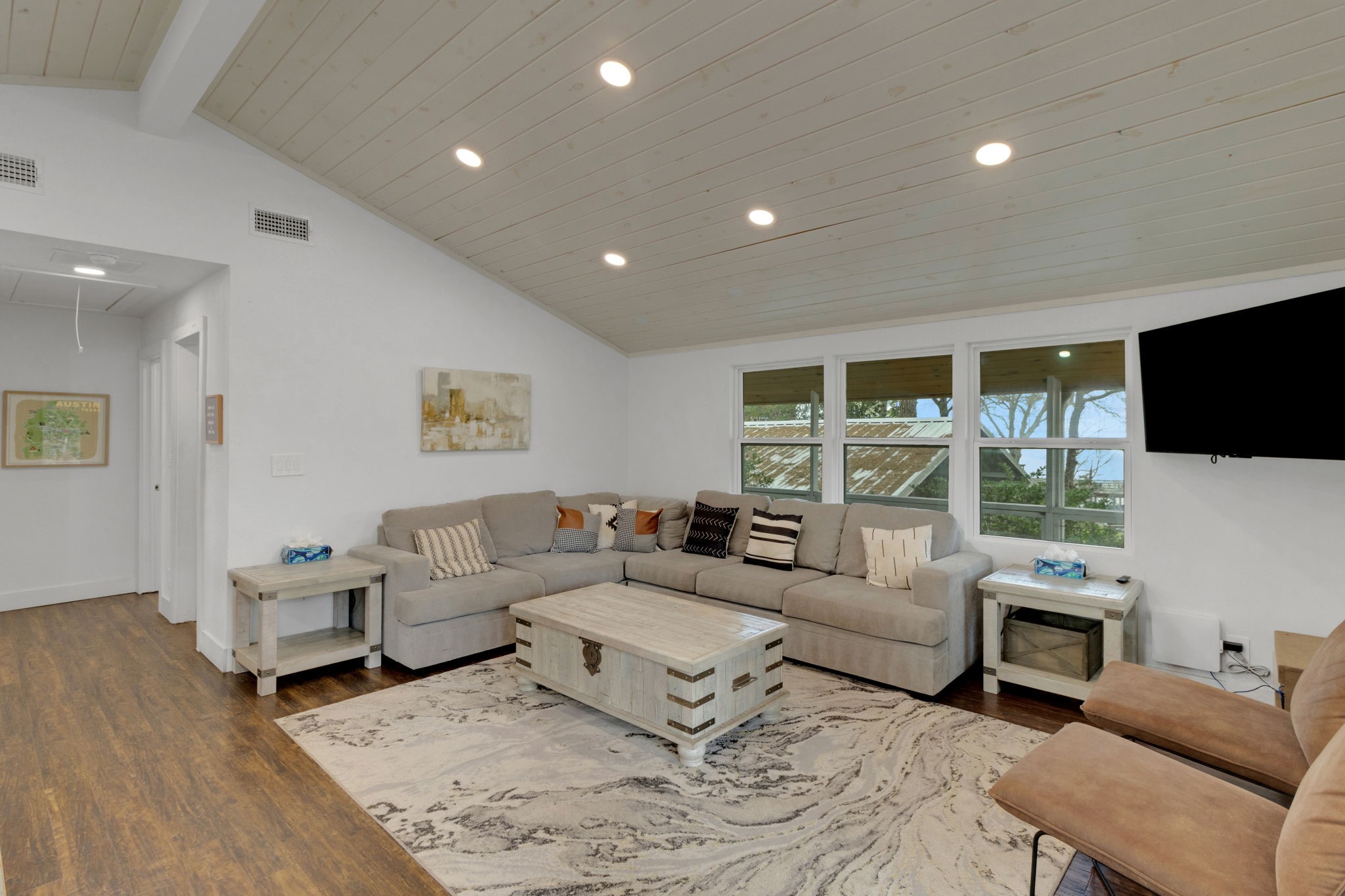 21 Red Bird Lane Coldspring, TX 77331 - Photo 7 of 37 Step inside to the living area with vaulted ceilings, engineered wood floors and neutral wall colors