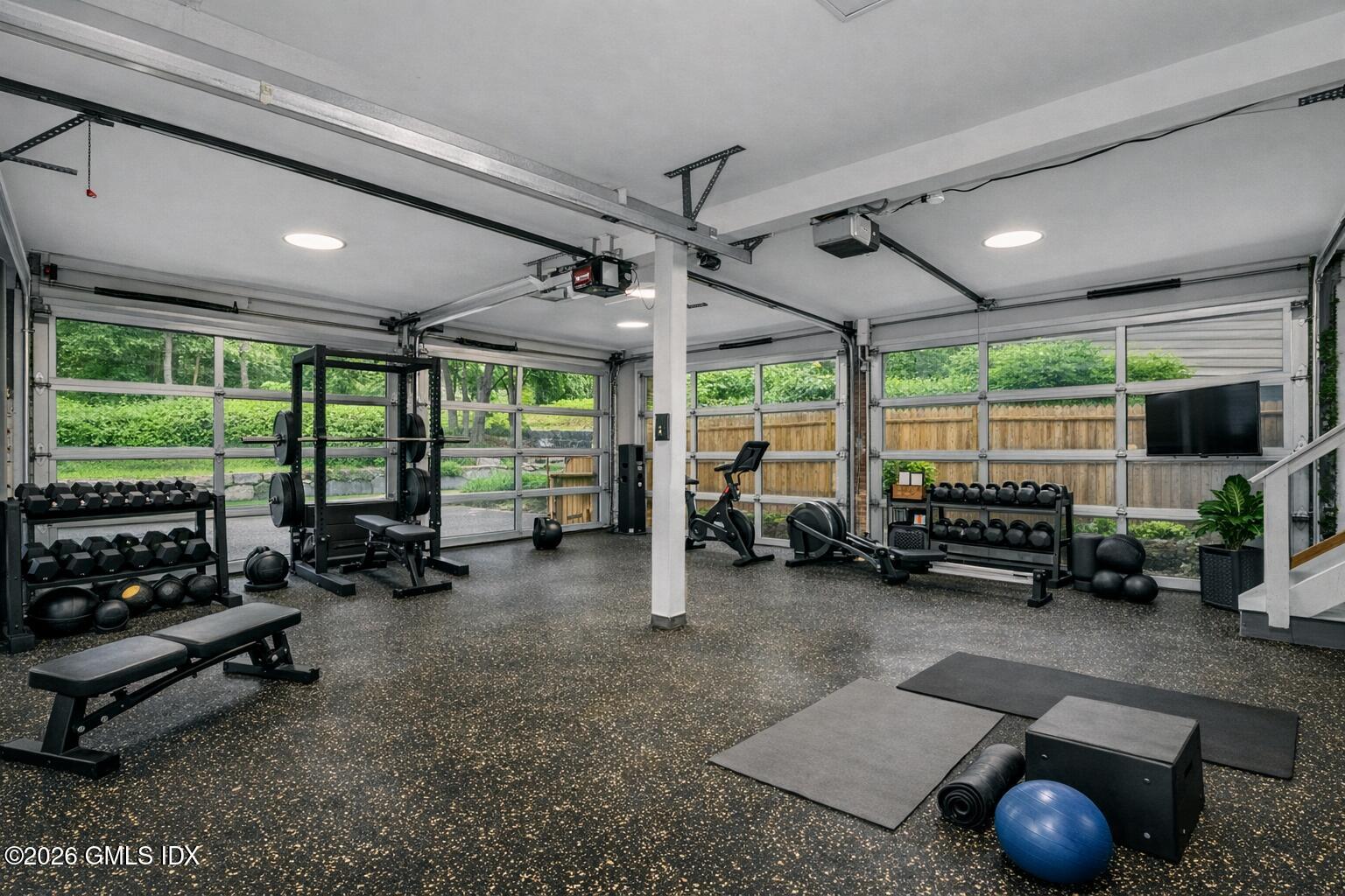 37 Prospect Street Greenwich, CT 06830 - Photo 32 of 41 a room with gym equipment and a large window
