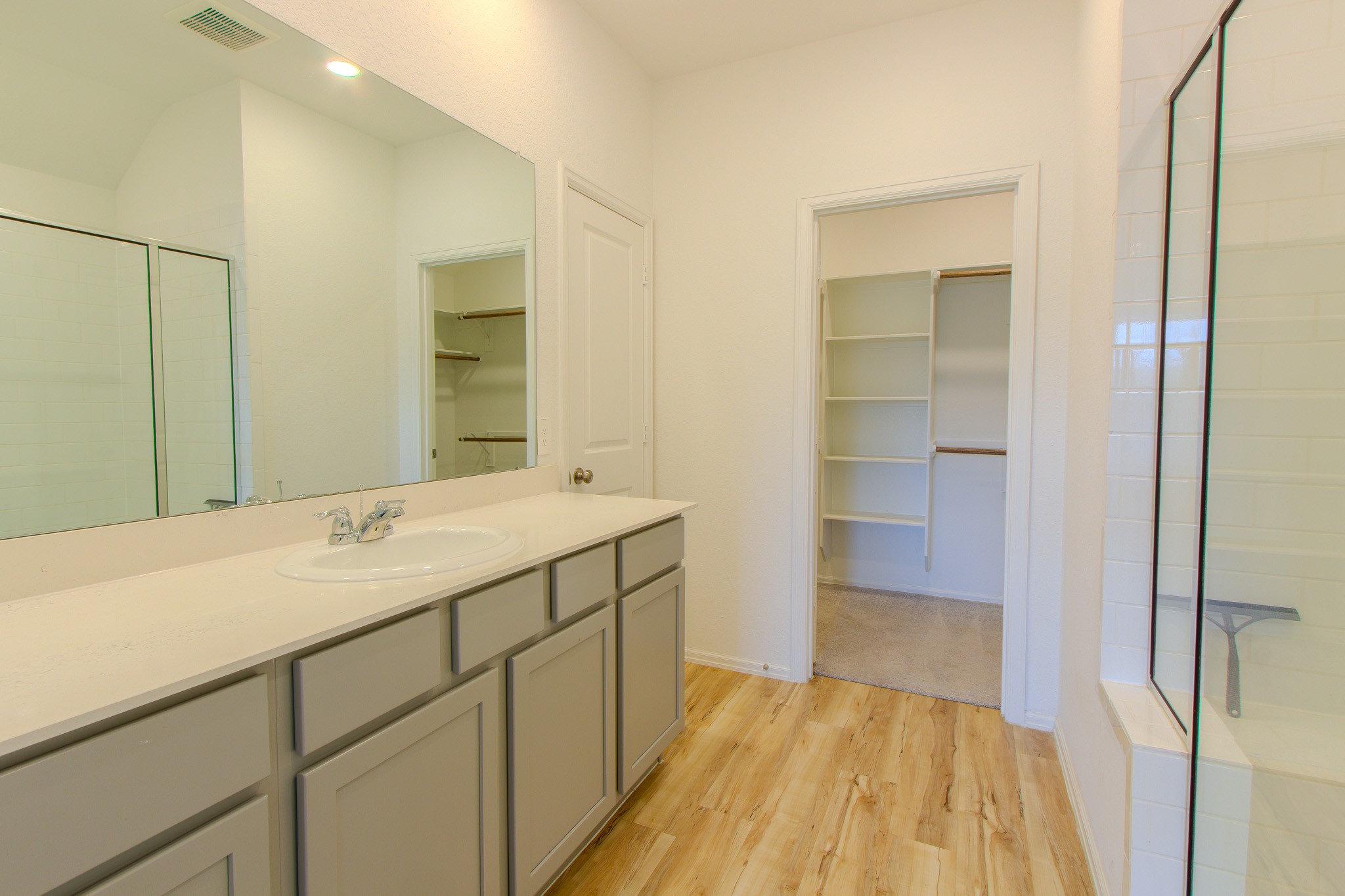 3113 Catalonion Court Conroe, TX 77301 - Photo 24 of 45 a bathroom with a sink and a mirror