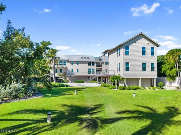 a table and chairs in front of a house