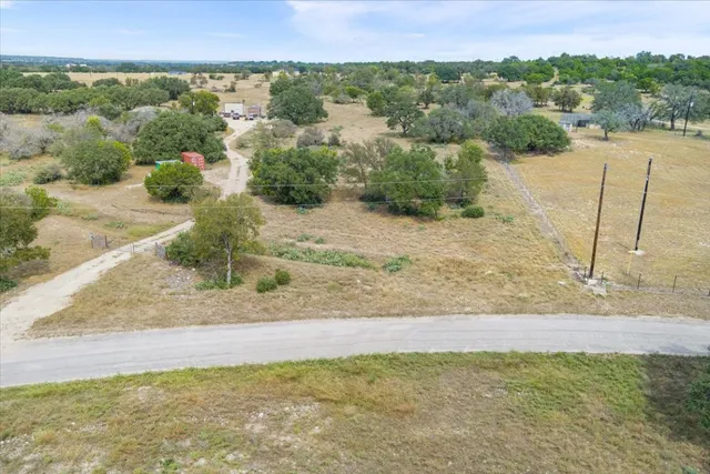 a view of a field with an ocean view