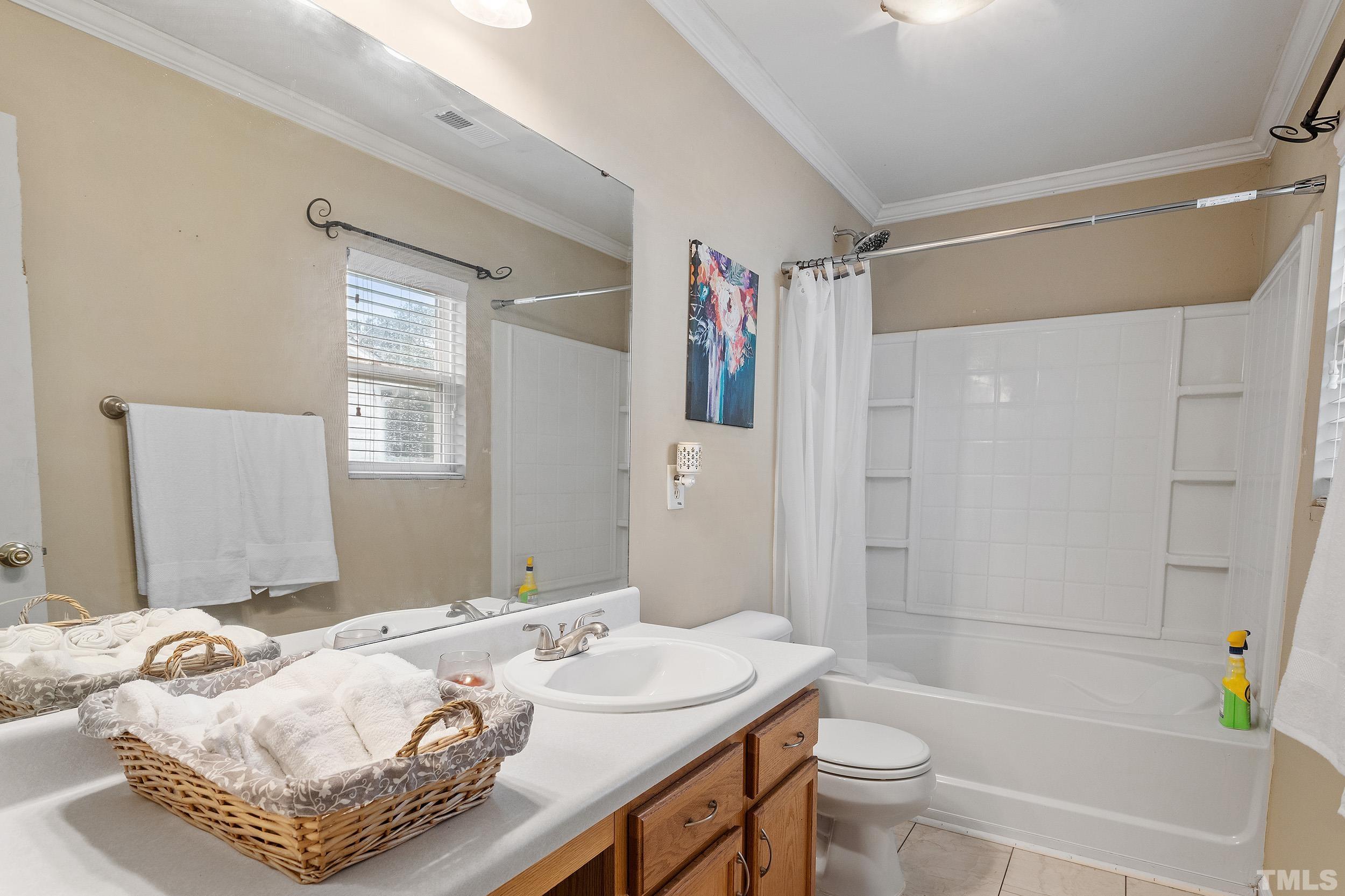 2500 Quarry Ridge Lane Raleigh, NC 27610 - Photo 19 of 29 a bath room with a toilet sink and a bath tub