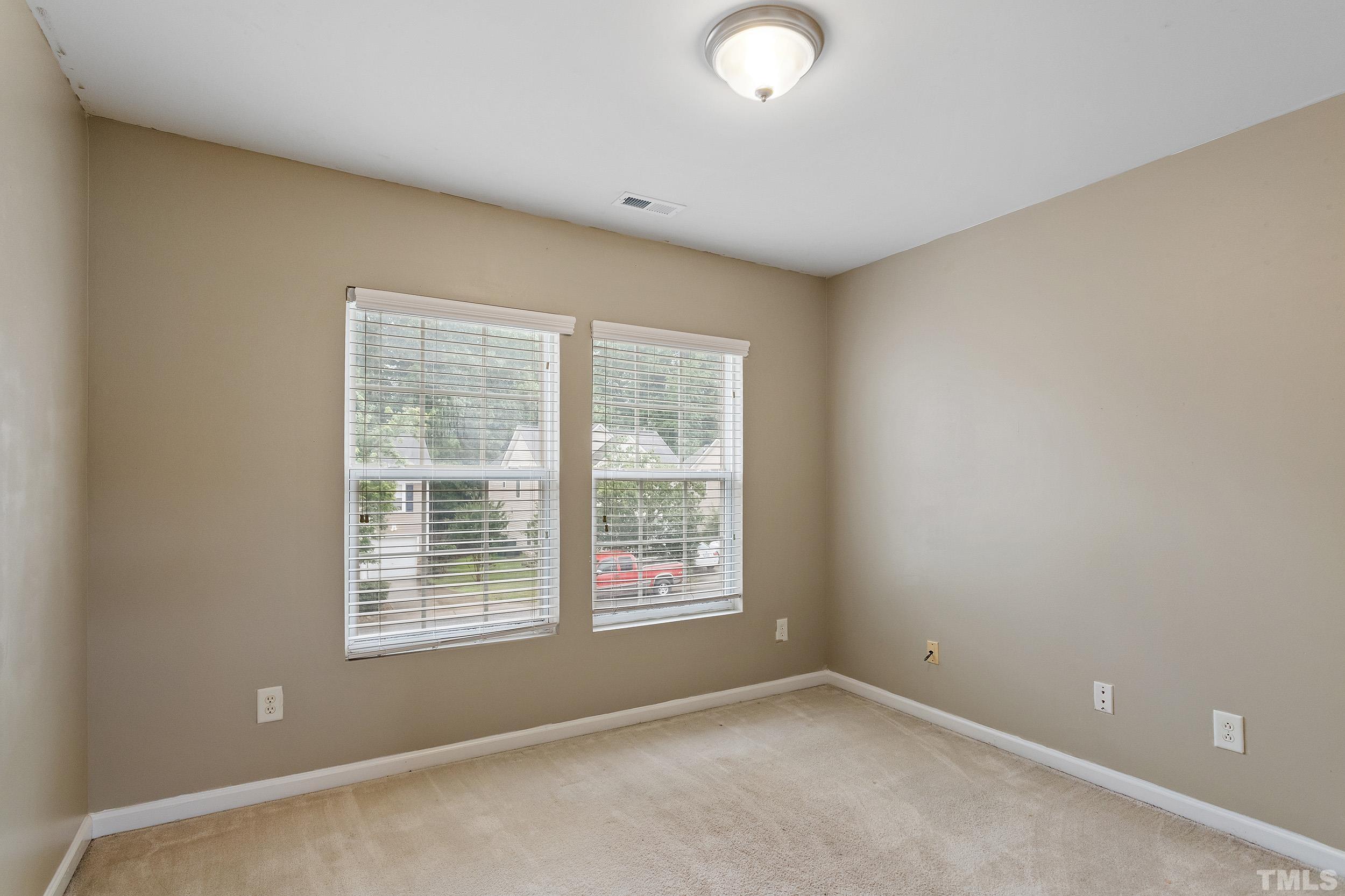 2500 Quarry Ridge Lane Raleigh, NC 27610 - Photo 23 of 29 an empty room with a window