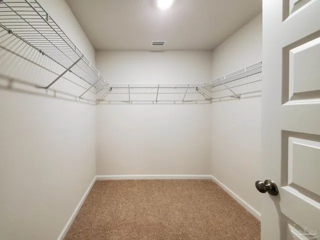 a view of a room with racks on the wall