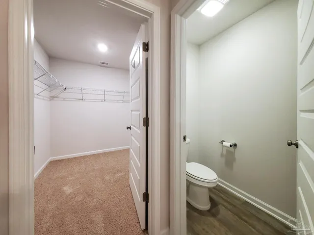 a bathroom with a granite countertop sink