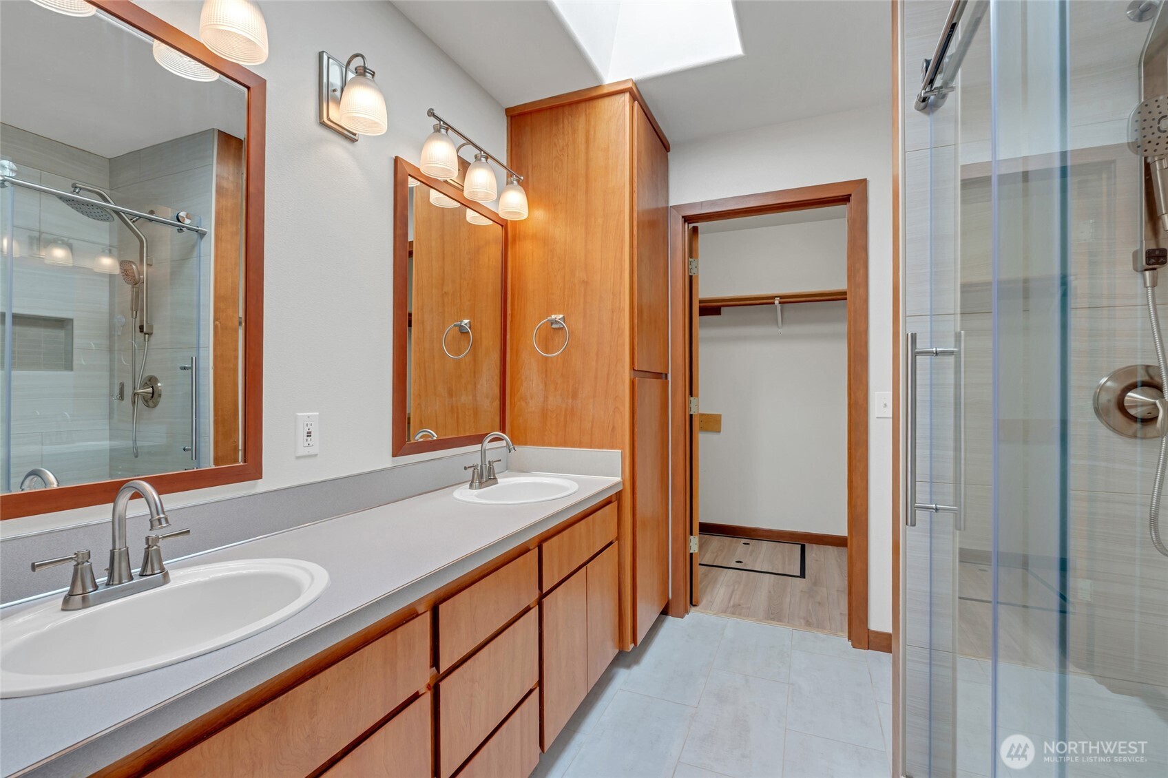 161 Duke Drive Sequim, WA 98382 - Photo 13 of 40 a spacious bathroom with a double vanity sink mirror and shower