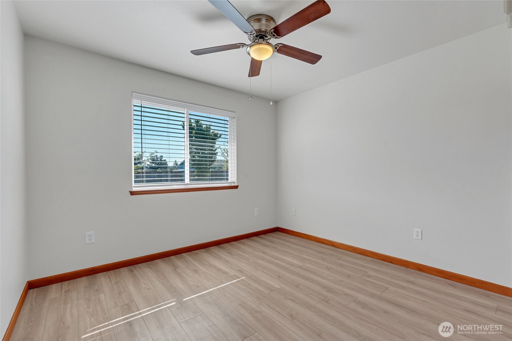 161 Duke Drive Sequim, WA 98382 - Photo 17 of 40 wooden floor in an empty room with a window