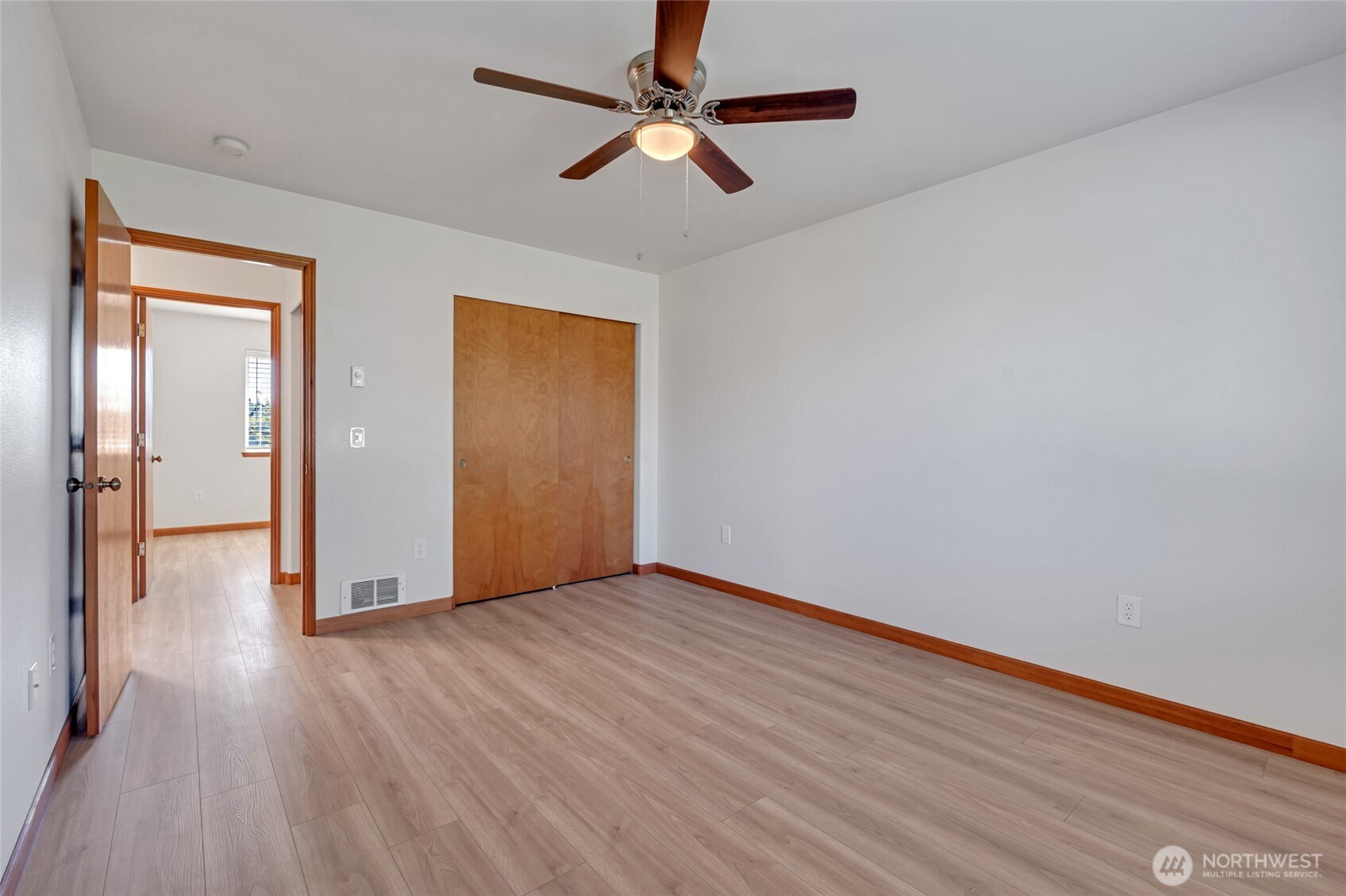 161 Duke Drive Sequim, WA 98382 - Photo 20 of 40 wooden floor in an empty room with a window