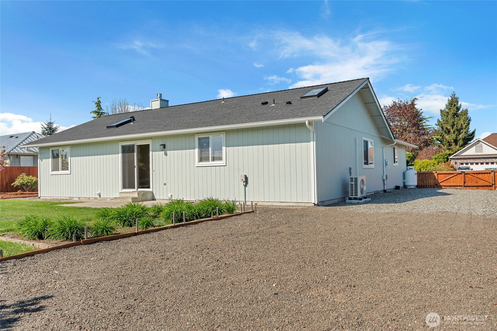 161 Duke Drive Sequim, WA 98382 - Photo 27 of 40 a front view of a house with a yard and garage