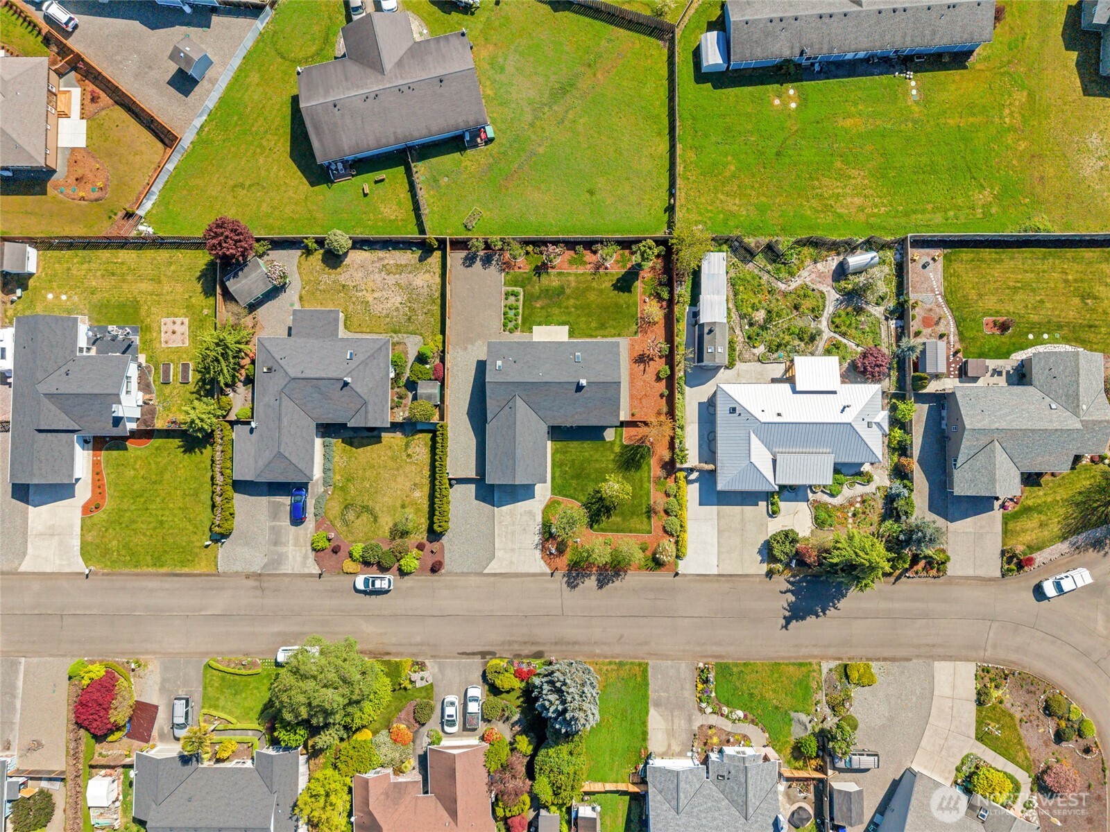 161 Duke Drive Sequim, WA 98382 - Photo 38 of 40 an aerial view of multiple houses with a swimming pool