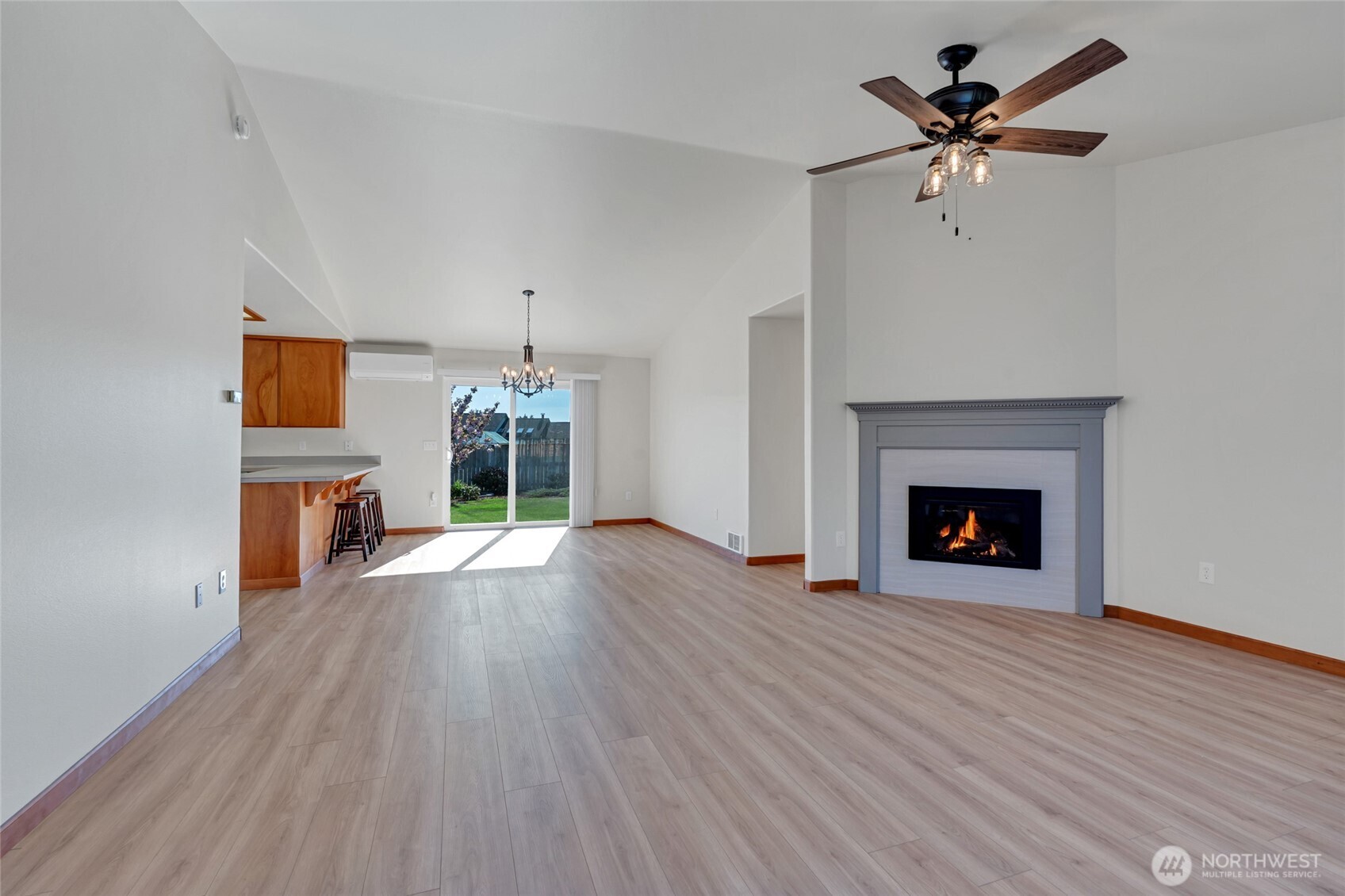 161 Duke Drive Sequim, WA 98382 - Photo 4 of 40 a view of an empty room with a fireplace and a window