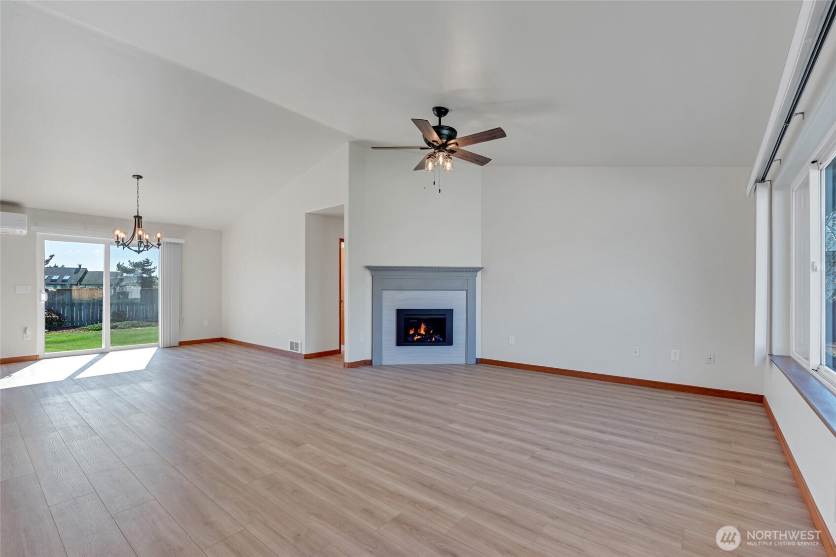 161 Duke Drive Sequim, WA 98382 - Photo 5 of 40 a view of an empty room with a fireplace and a window