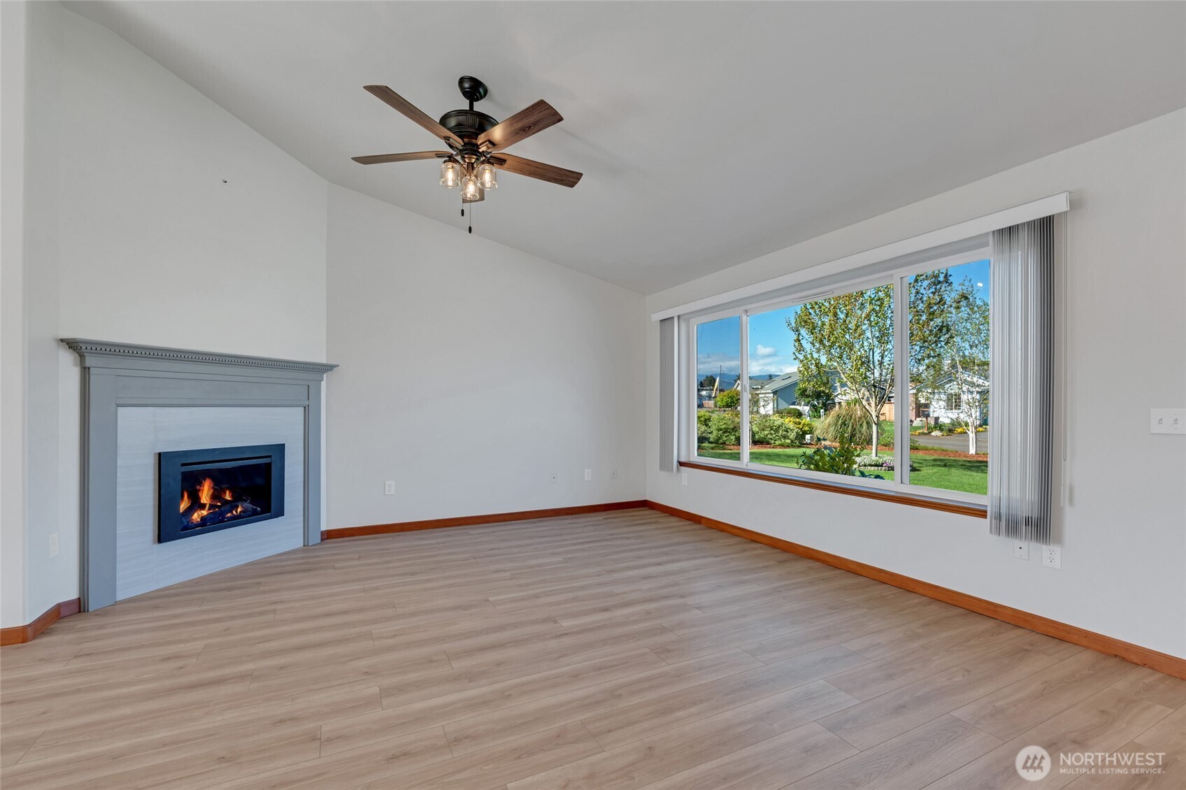 161 Duke Drive Sequim, WA 98382 - Photo 6 of 40 a view of wooden floor a chandelier and a fireplace