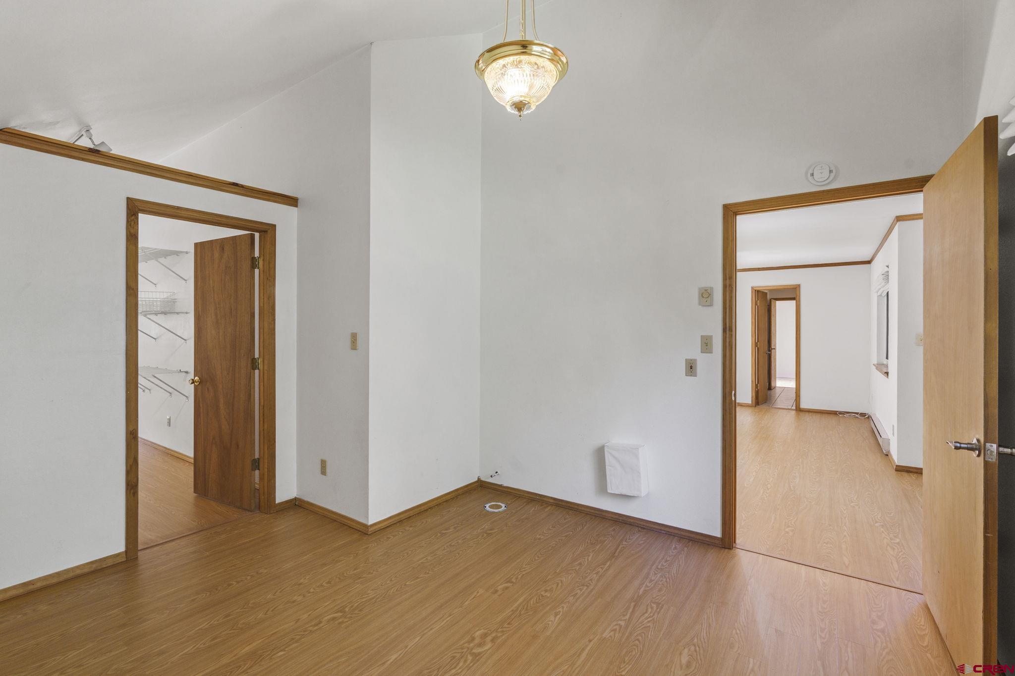 37 Verde Lane Durango, CO 81301 - Photo 28 of 45 a view of empty room with wooden floor