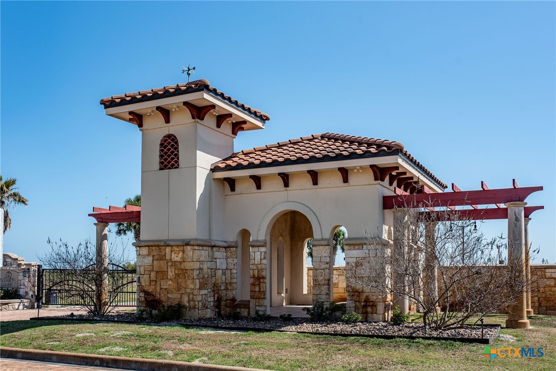Lot 296 East Lago Loop Rd Port Port O'Connor, TX 77982 - Photo 13 of 13 a front view of a house with garden