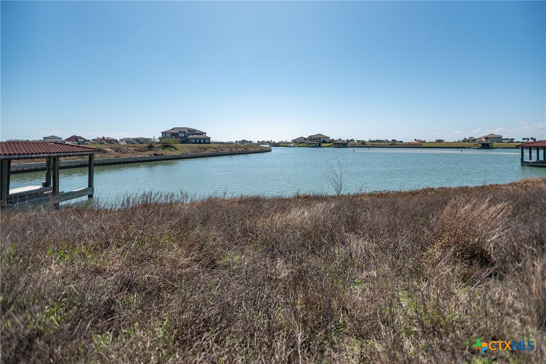 Lot 296 East Lago Loop Rd Port Port O'Connor, TX 77982 - Photo 8 of 13 a view of a lake from a yard