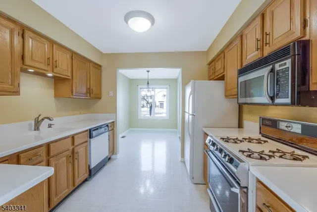 a kitchen that has a sink and a stove