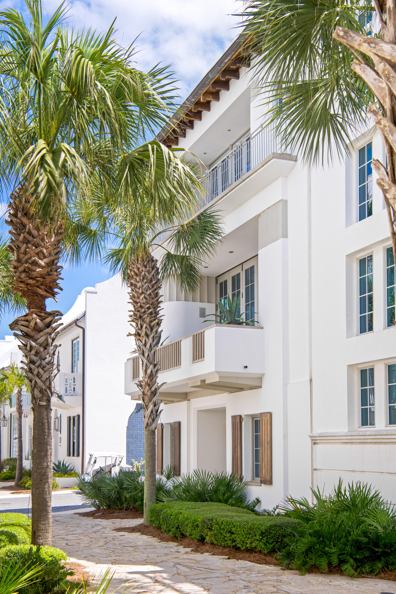130 Sea Garden Street Inlet Beach, FL 32461 - Photo 6 of 77 a front view of a multi story building with yard