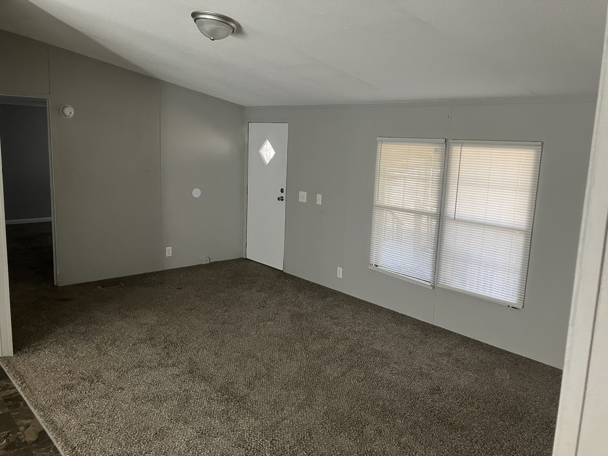 2412 Whitfield Road Clarksville, TN 37040 - Photo 11 of 18 an empty room with a empty space and windows