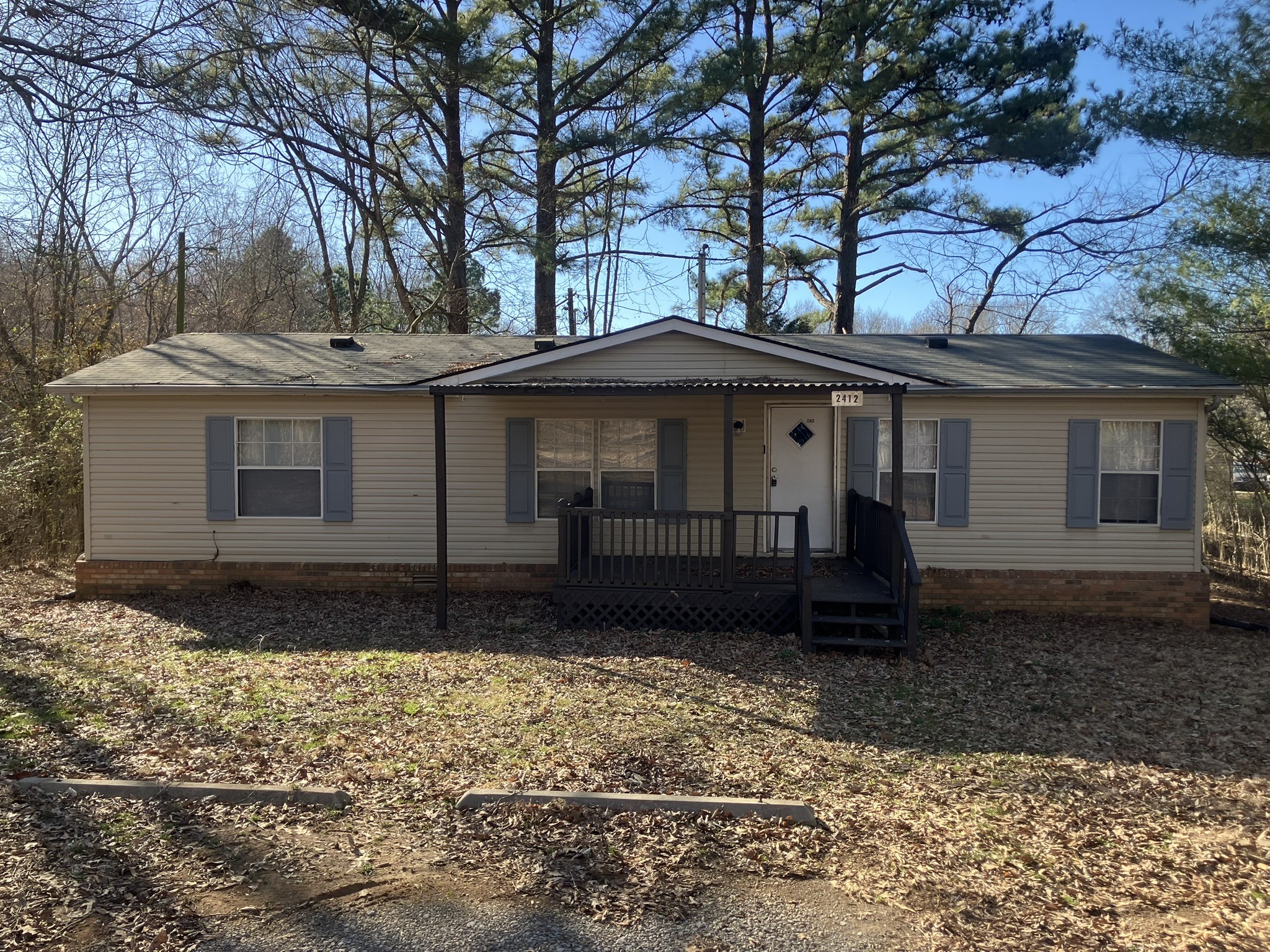 2412 Whitfield Road Clarksville, TN 37040 - Photo 2 of 18 a front view of a house with a yard