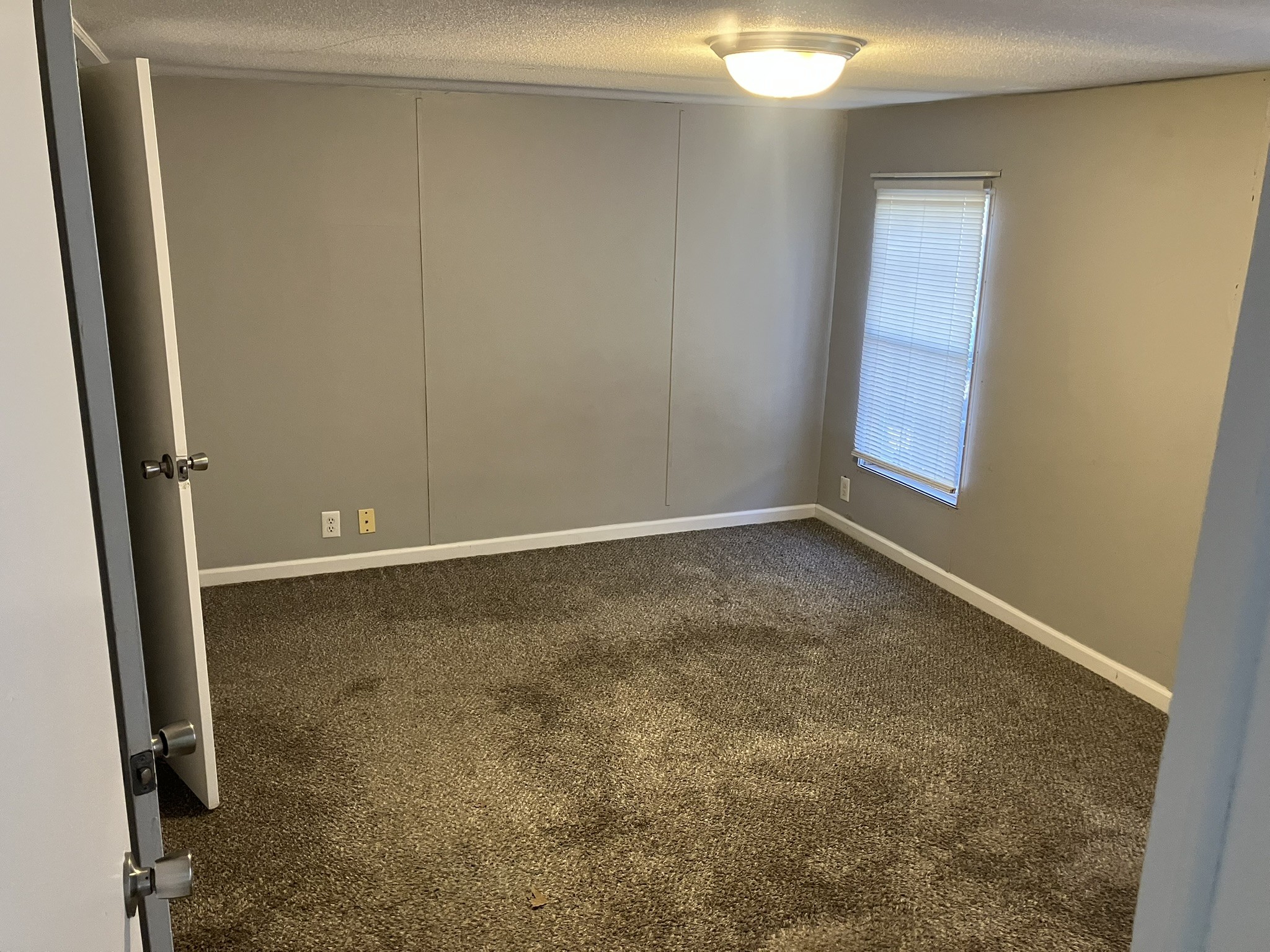 2412 Whitfield Road Clarksville, TN 37040 - Photo 7 of 18 an empty room with a door