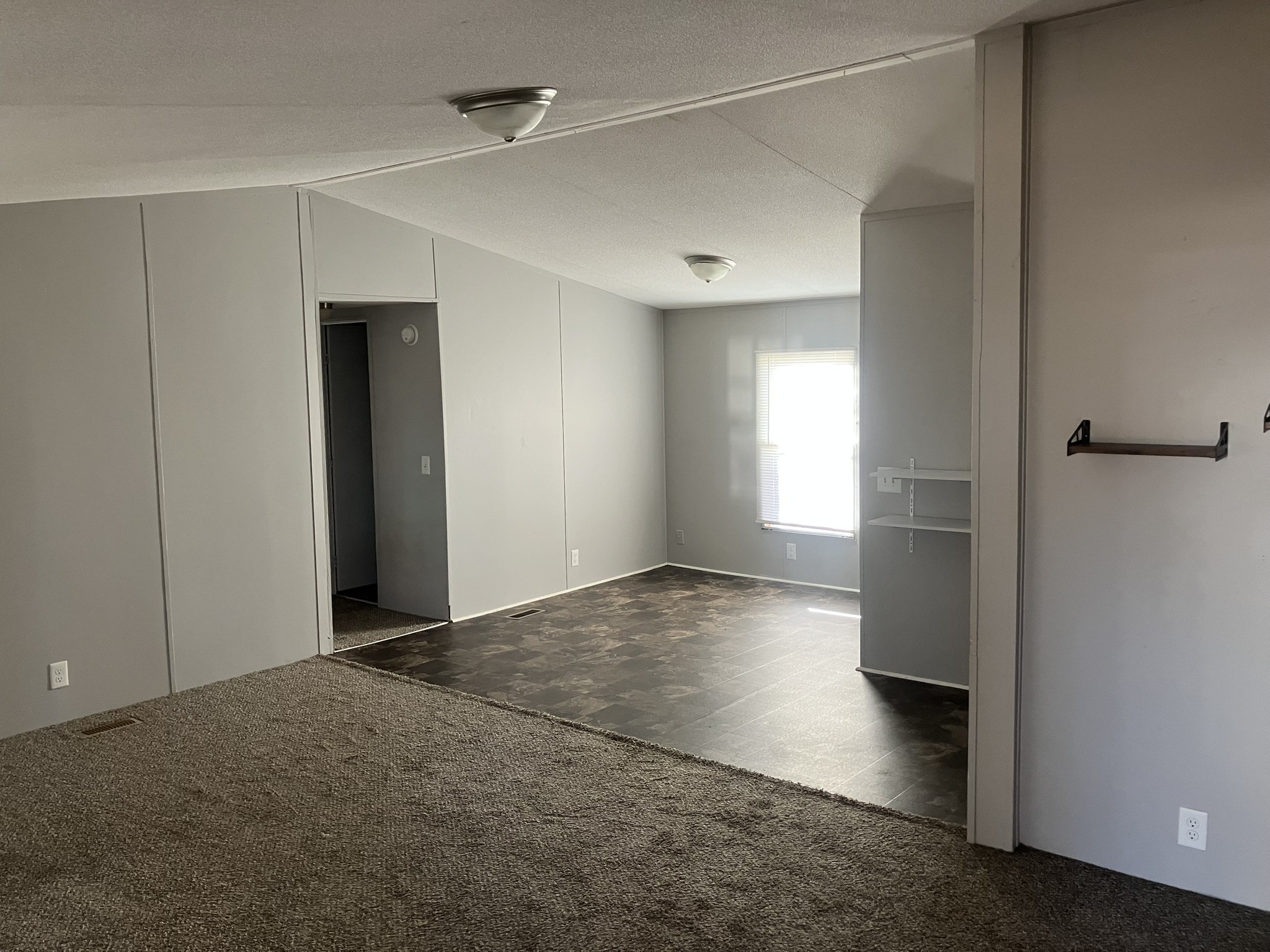 2412 Whitfield Road Clarksville, TN 37040 - Photo 9 of 18 a view of empty room with wooden floor and fan
