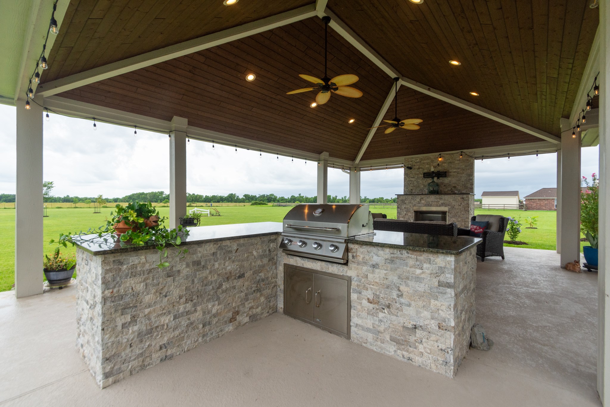 7818 Pebble Hill Lane Rosharon, TX 77583 - Photo 13 of 47 a kitchen with stainless steel appliances granite countertop a sink a stove and a refrigerator
