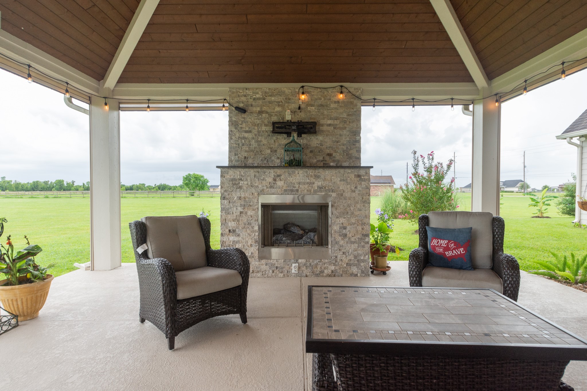 7818 Pebble Hill Lane Rosharon, TX 77583 - Photo 14 of 47 a view of a patio with couches chairs and potted plants