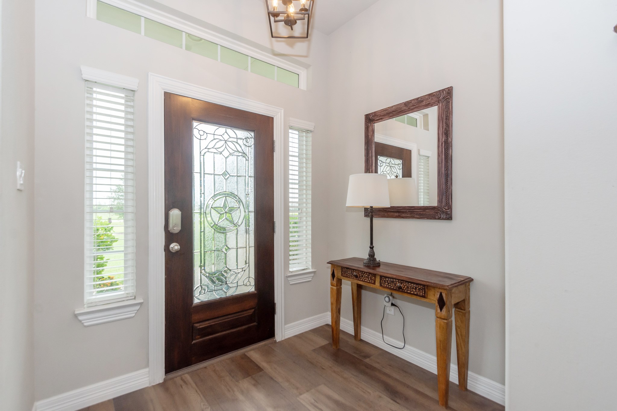 7818 Pebble Hill Lane Rosharon, TX 77583 - Photo 18 of 47 a view of an entryway with wooden floor and cabinet