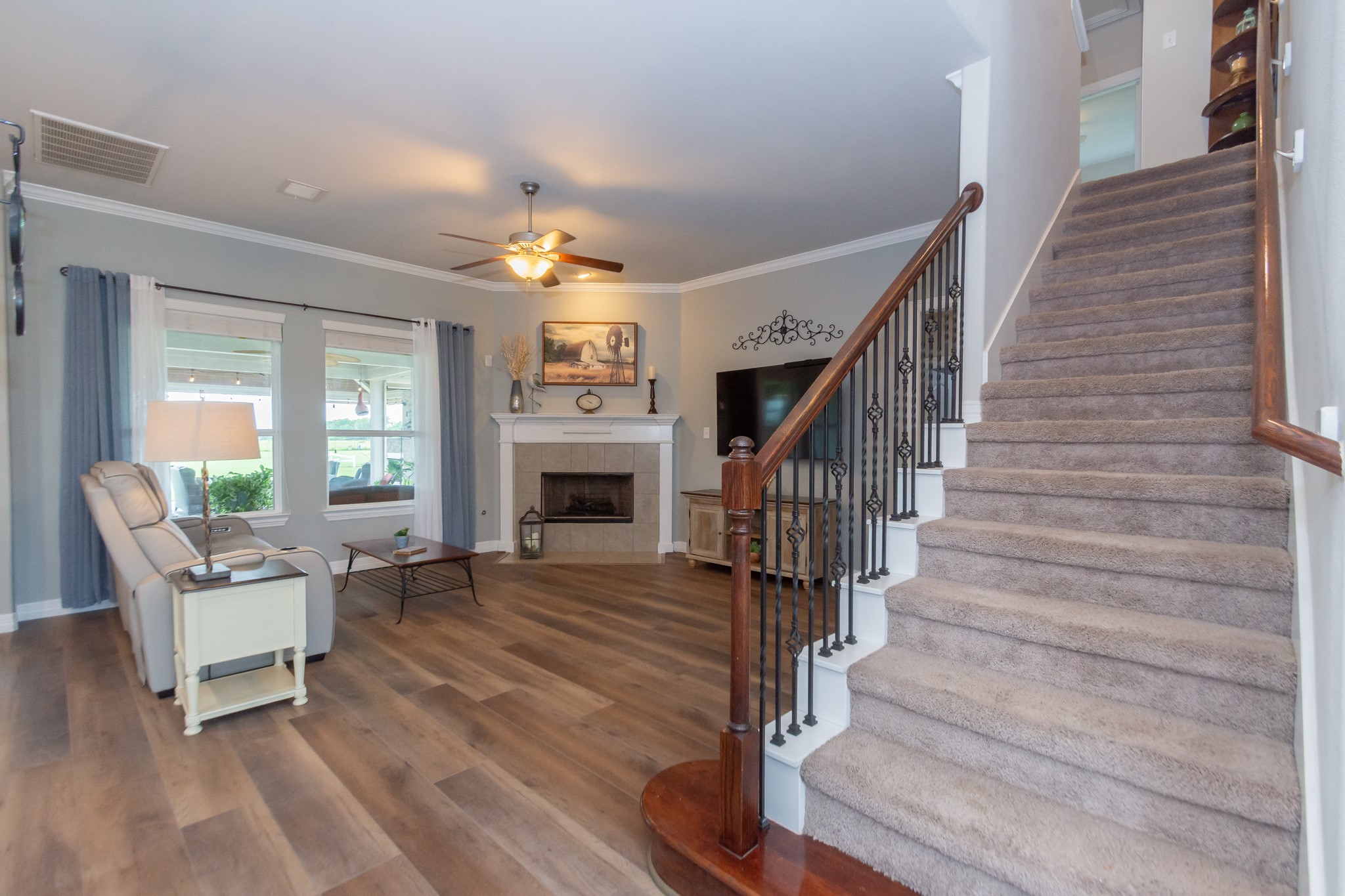 7818 Pebble Hill Lane Rosharon, TX 77583 - Photo 19 of 47 a view of entryway livingroom and hall with wooden floor