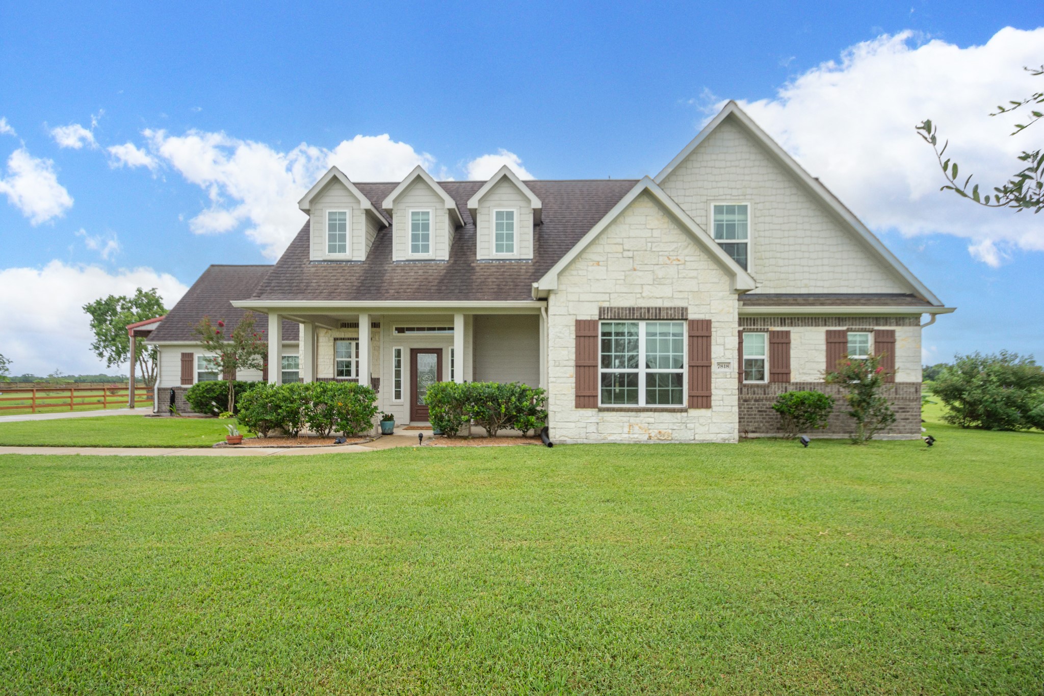 7818 Pebble Hill Lane Rosharon, TX 77583 - Photo 2 of 47 a front view of a house with a yard