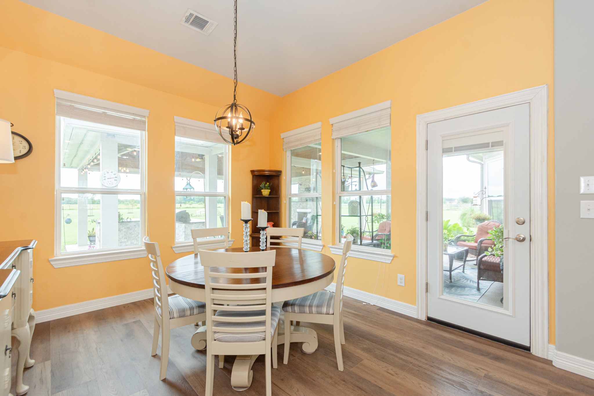 7818 Pebble Hill Lane Rosharon, TX 77583 - Photo 27 of 47 a dining room with furniture window wooden floor