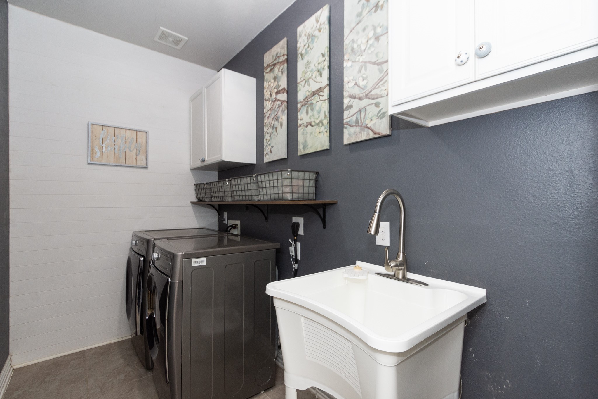 7818 Pebble Hill Lane Rosharon, TX 77583 - Photo 28 of 47 a kitchen with a sink a stove and cabinets