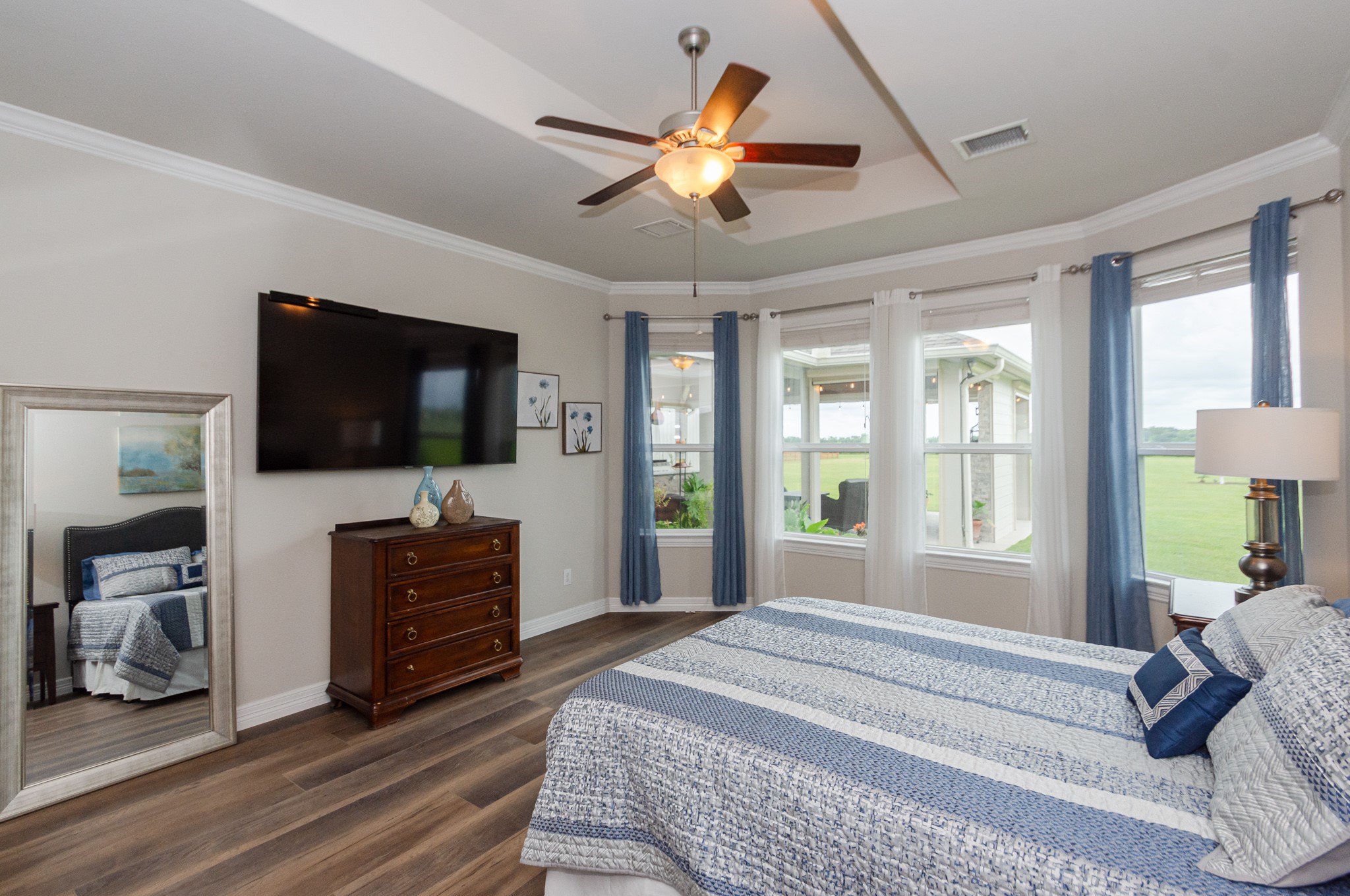 7818 Pebble Hill Lane Rosharon, TX 77583 - Photo 31 of 47 a spacious bedroom with a bed and a flat screen tv