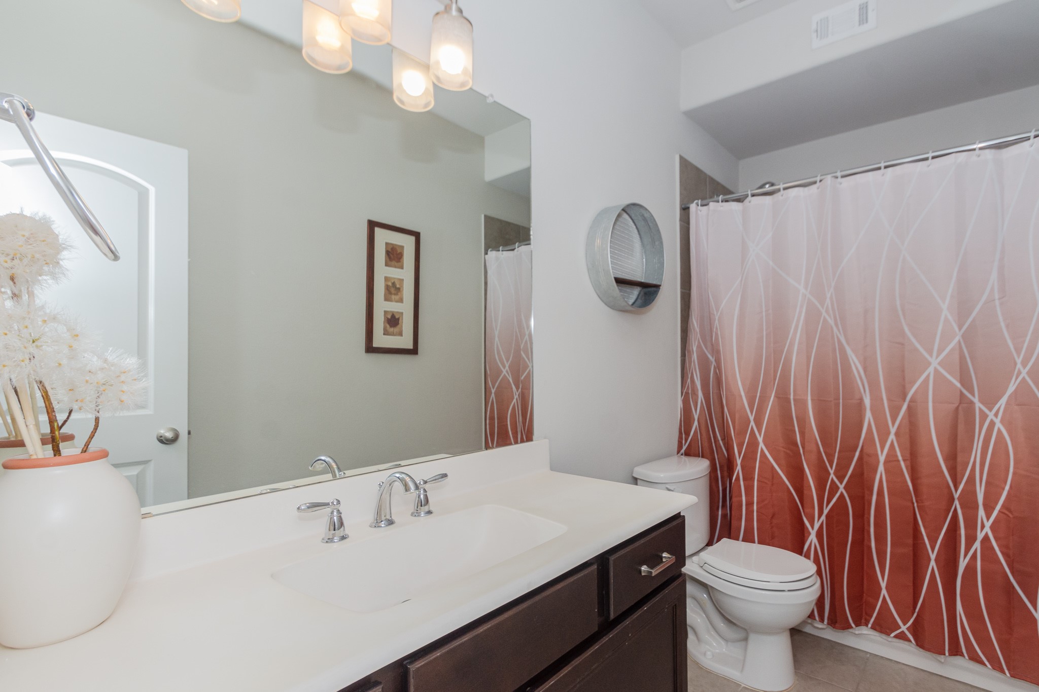 7818 Pebble Hill Lane Rosharon, TX 77583 - Photo 35 of 47 a bathroom with a sink a toilet and shower curtain