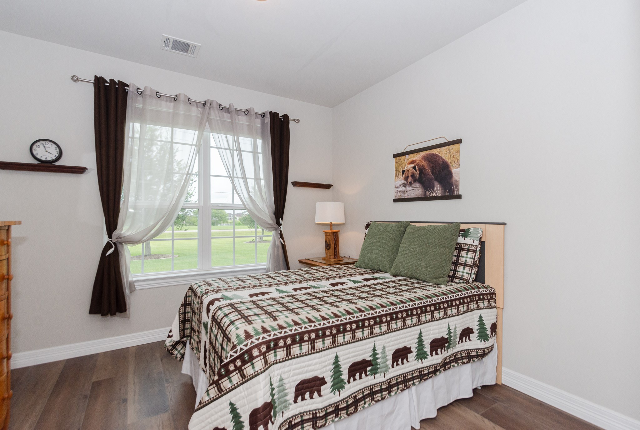 7818 Pebble Hill Lane Rosharon, TX 77583 - Photo 36 of 47 a bed sitting in a bedroom next to a window