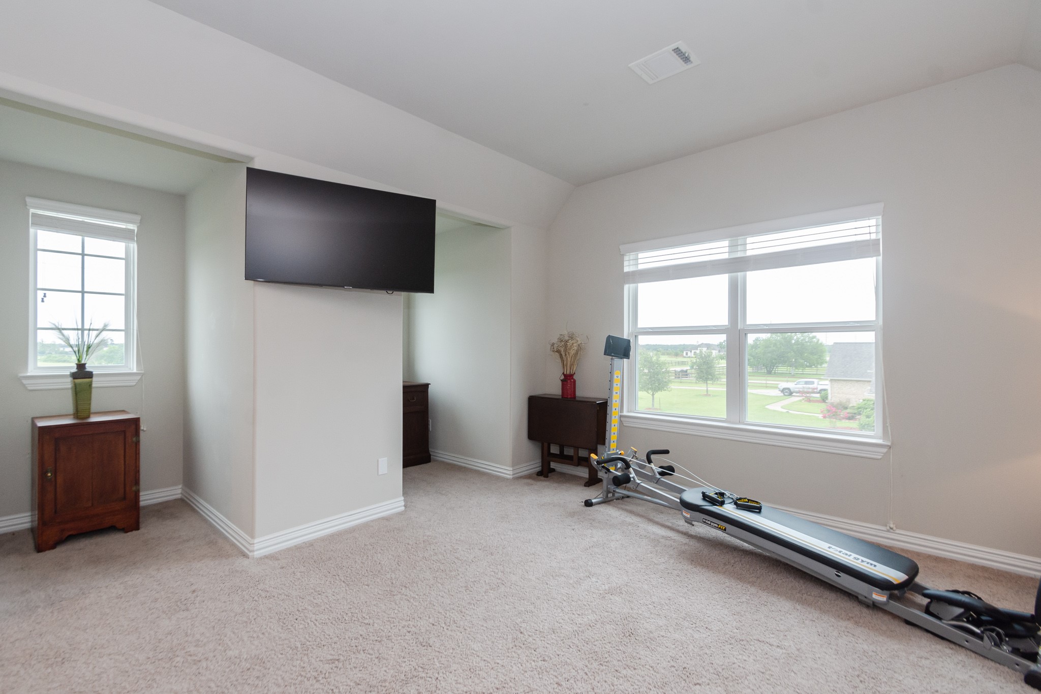 7818 Pebble Hill Lane Rosharon, TX 77583 - Photo 39 of 47 a view of a livingroom with a flat screen tv and windows
