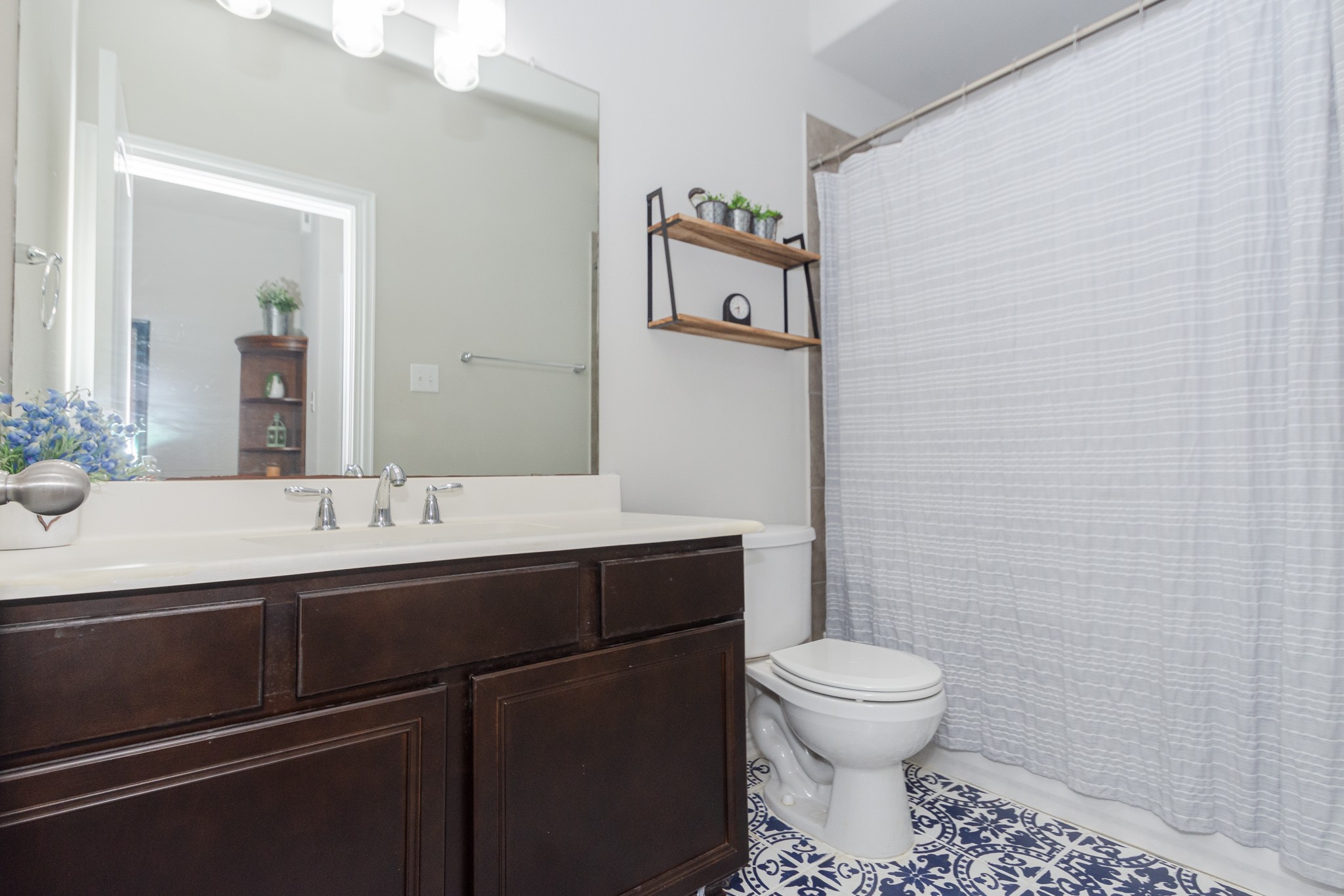 7818 Pebble Hill Lane Rosharon, TX 77583 - Photo 41 of 47 a bathroom with a toilet sink and mirror