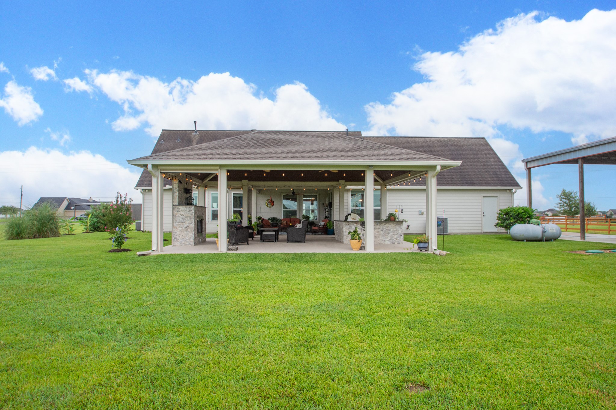7818 Pebble Hill Lane Rosharon, TX 77583 - Photo 47 of 47 a view of a house with backyard porch and garden