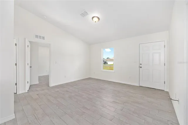 a view of an empty room with a window