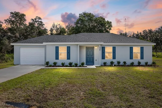 front view of a house with a yard