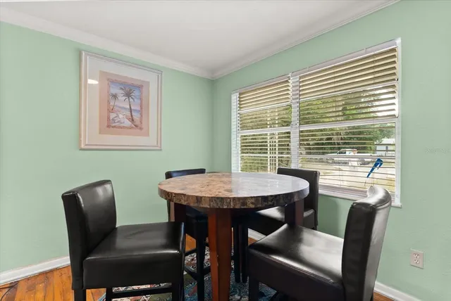a view of a dining room with furniture window and outside view