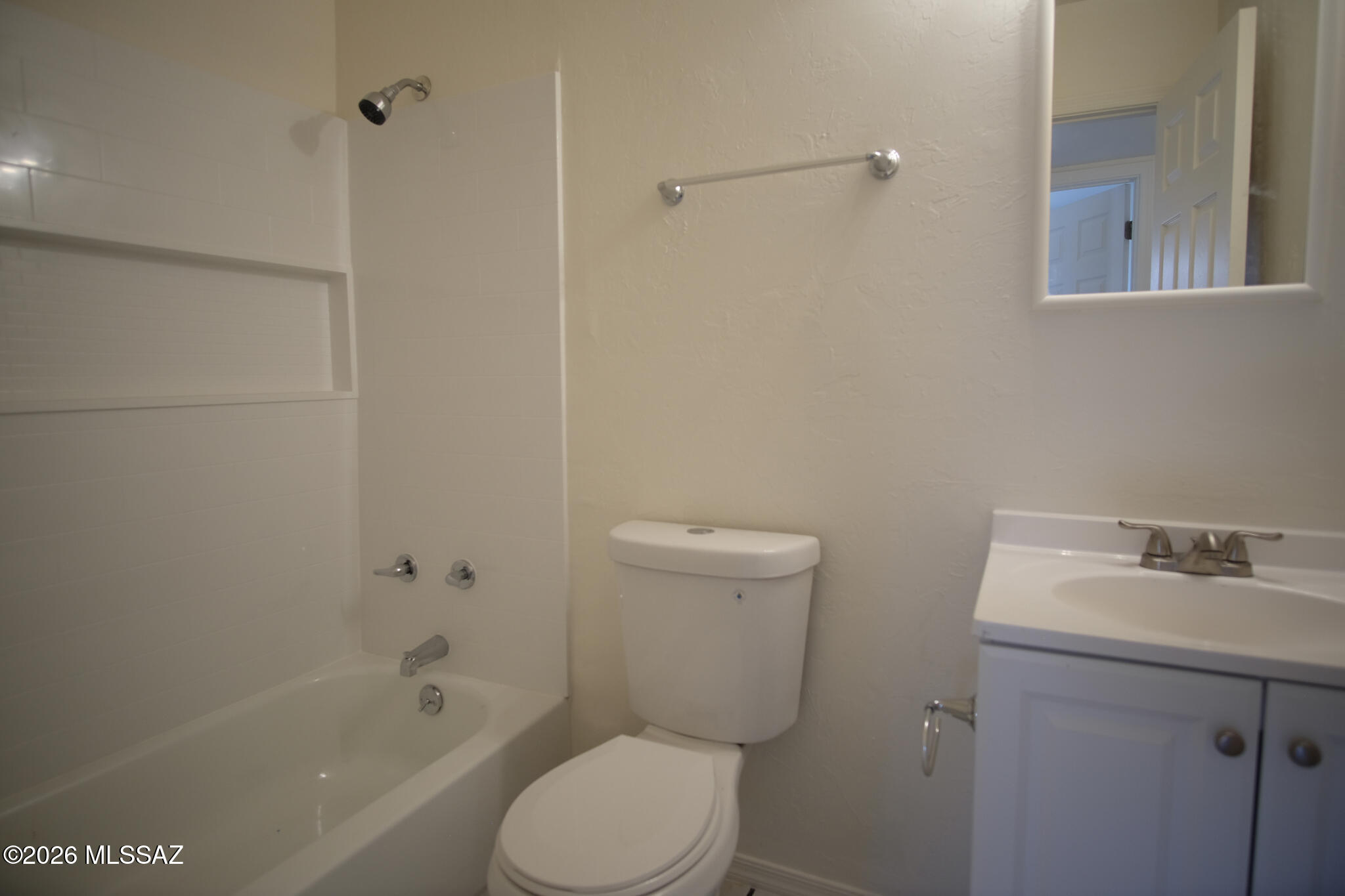 345 East Delta Road Tucson, AZ 85706 - Photo 16 of 45 a white toilet sitting next to a bath tub