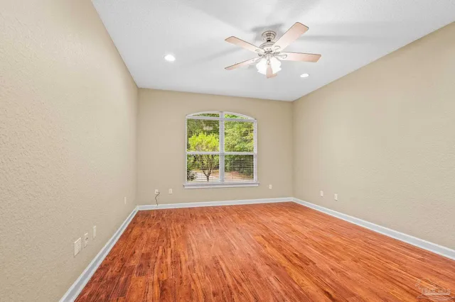 a spacious bathroom with a granite countertop sink mirror and shower